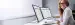 Businessfrau am Schreibtisch arbeitet mit Microsoft 365 Programmen, Copyright: Andrey Popov - stock.adobe.com